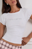 who cares graphic white baby tee